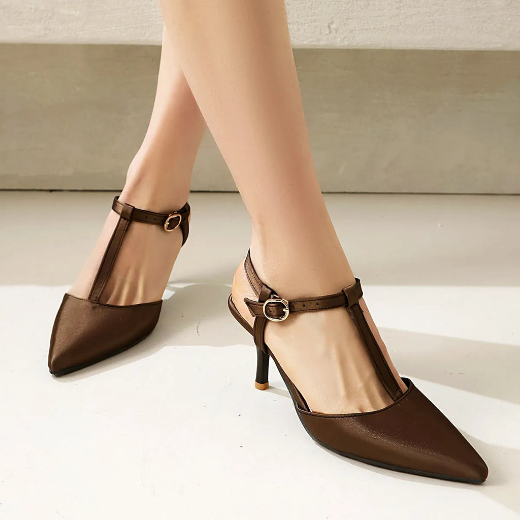 Women's pointed toe T-strap high heels in black top grain leather with unlined inner