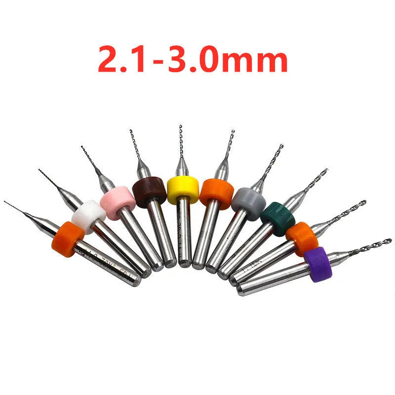 Ten small tungsten carbide circuit board drill bits with straight 3.2mm shanks on a white background.
