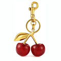 Red zinc alloy cherry-shaped keychain pendant with a three-dimensional design.