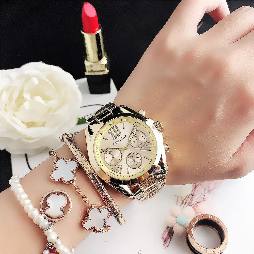 Women's silver rose gold fashion watch with mesh strap and pointer display.