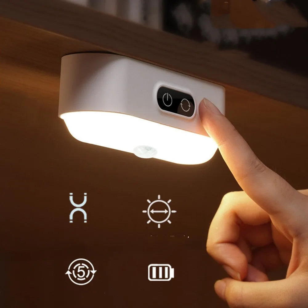 White magnetic USB rechargeable LED sensor light with touch controls on a curved panel