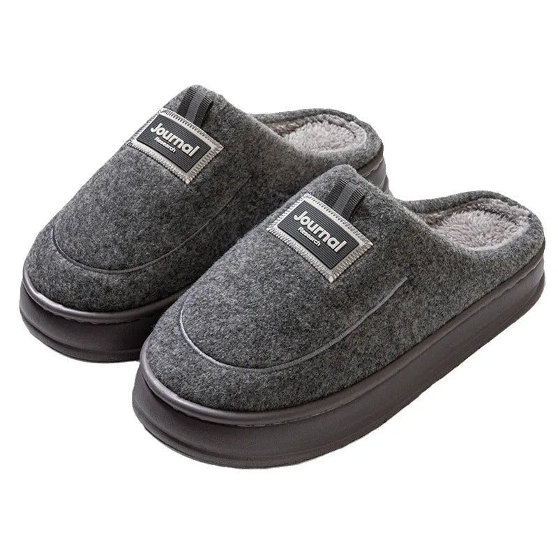 Men's brown thickened cotton slippers with a suede upper and textured sole, shown from the side.