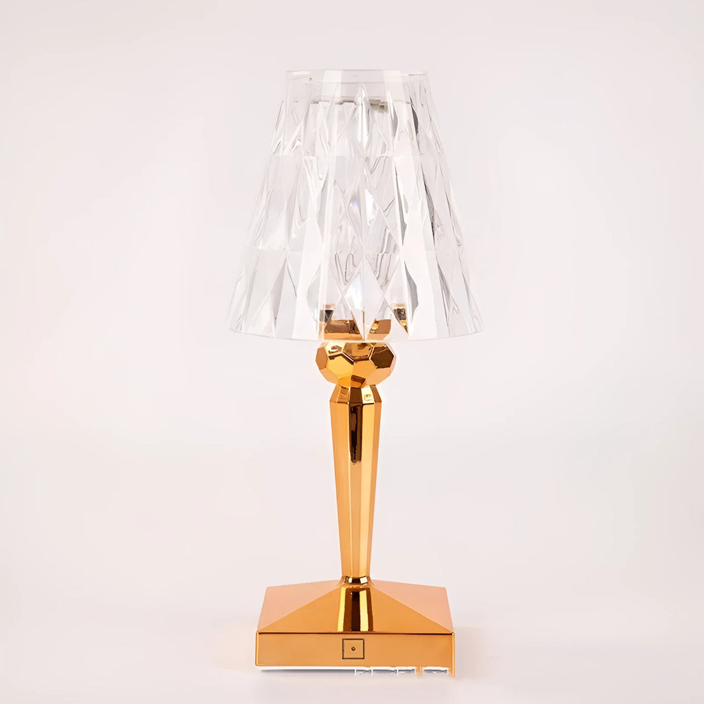 Rose gold portable touch night light on a surface showing its dimmable glow.