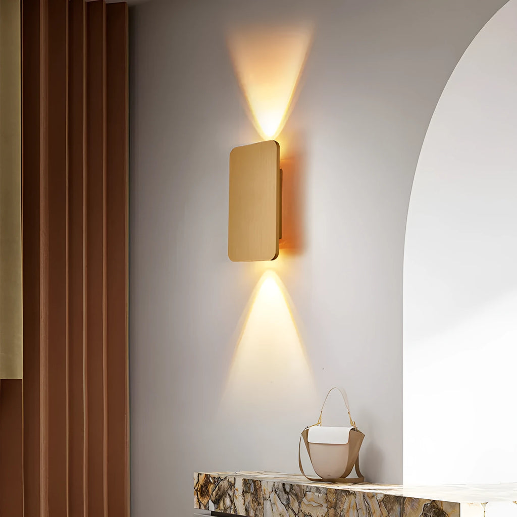 Minimalist modern wall lamp in black finish mounted beside a bed, showing its slim profile.