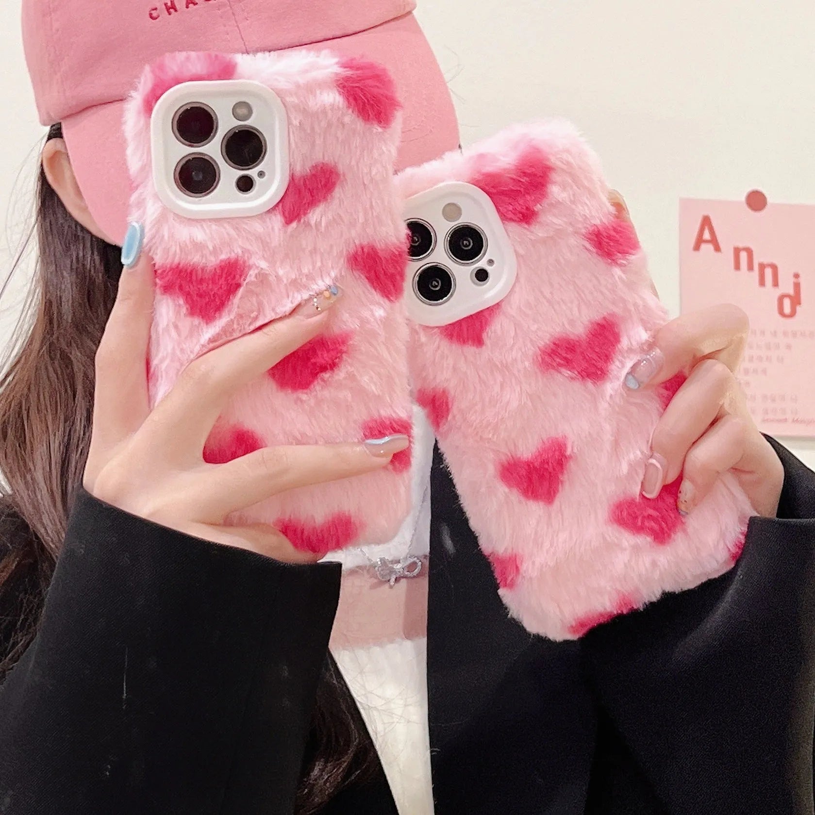 Pink silicone iPhone case with a cartoon design on the back.