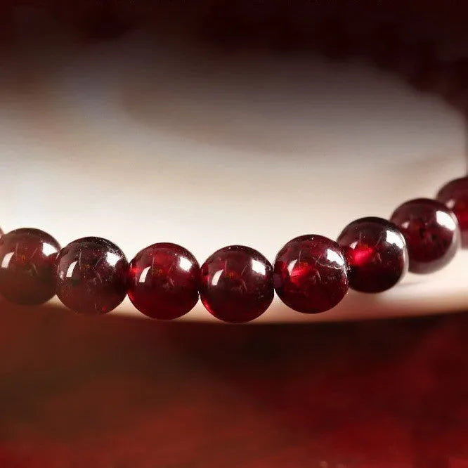 Chinese style gourd bracelet with imitation garnet beads and Fu character charms in U-shaped design