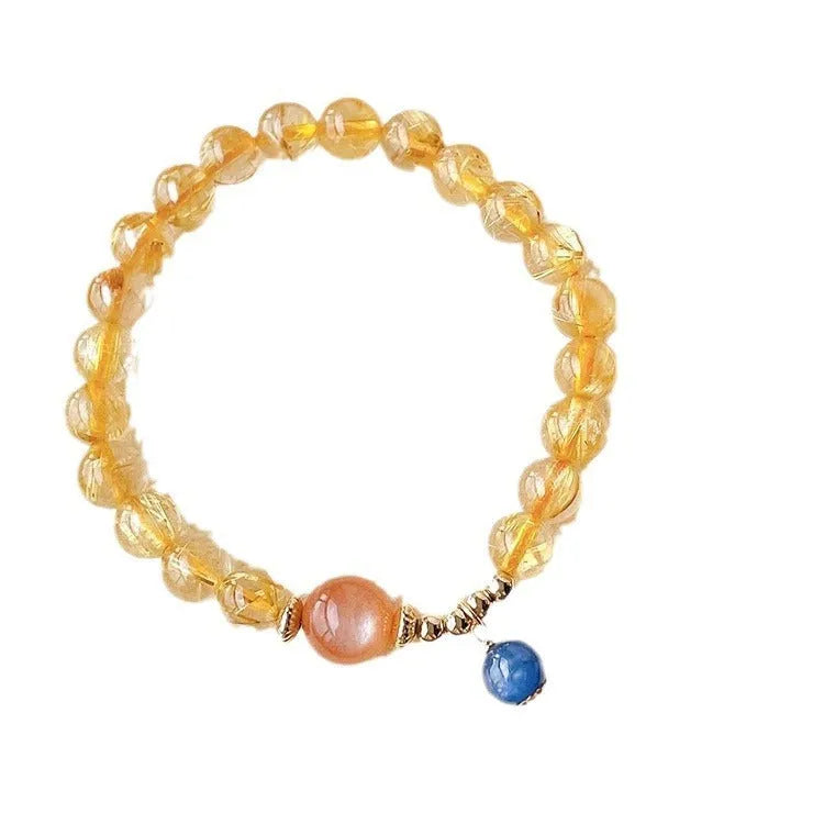 Gold rutilated quartz sunstone bracelet with round beads and diamond-shaped elements