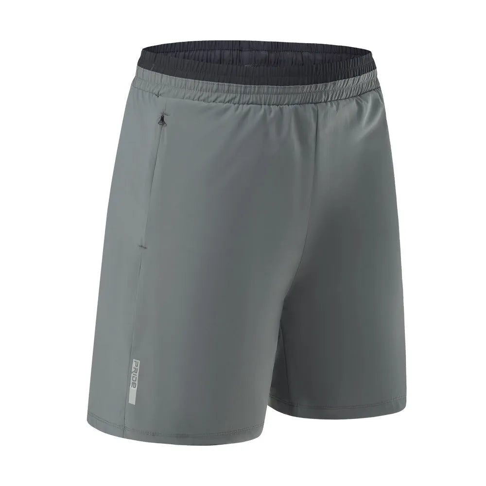 Man wearing grey loose-fit cropped Ice Silk pants for running or leisure.
