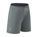 Man wearing grey loose-fit cropped Ice Silk pants for running or leisure.