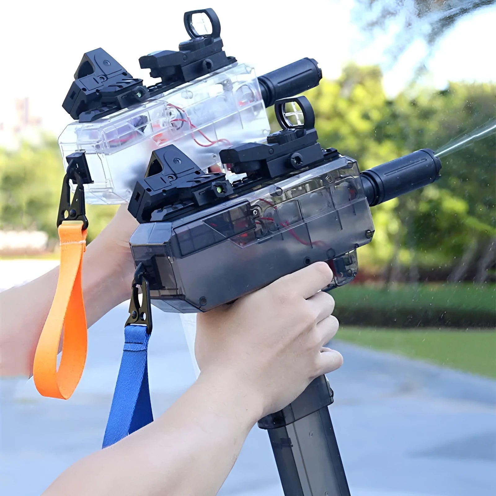 Uzi-style transparent electric water gun toy with accessories on blue background