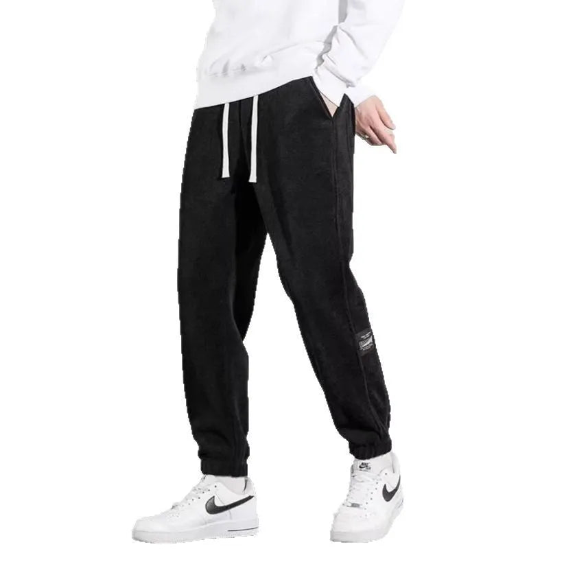 Men's loose straight drapey sweatpants in dark gray with drawstring waist and cotton blend fabric