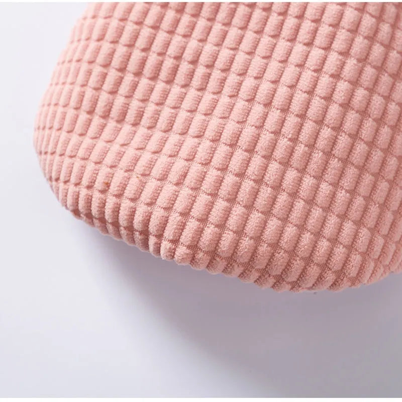 Pink ribbed corduroy dog vest with metal leash ring and bear emblem tag, sizes XS to XXL.