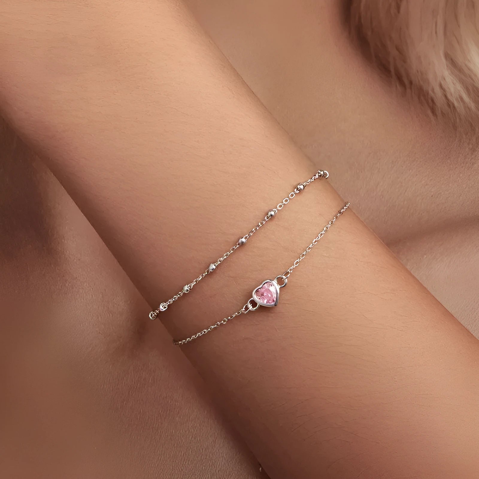 Sterling silver bracelet with heart pendant on adjustable chain