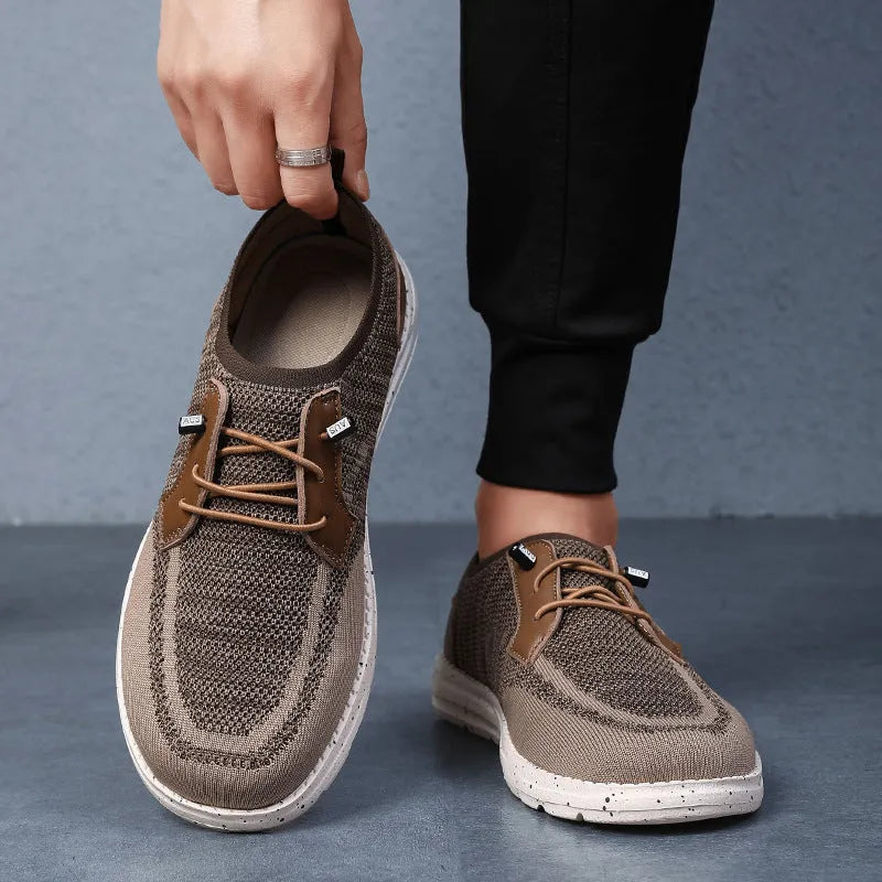 Men's black laceless canvas shoes with low-top design and round toe