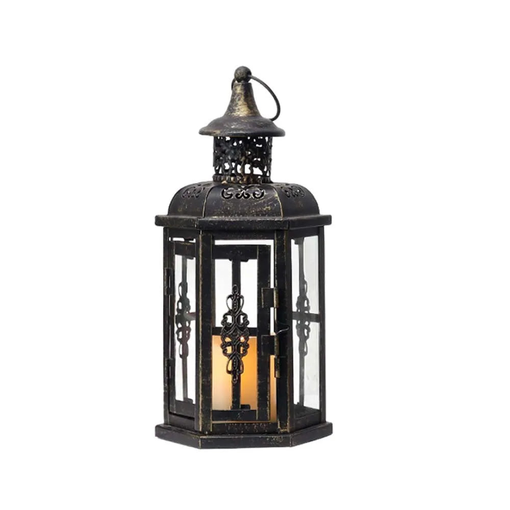Black retro metal candle holder with glass insert on a wooden surface
