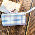 Square double-layer canvas stationery bag in a striped pattern, shown in one of six available colours.