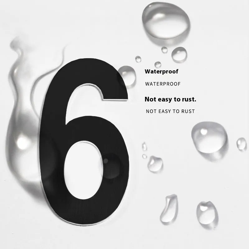 Black stainless steel sticky house numbers set showing characters A, B, 1, 2, 3 on adhesive backing.