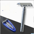 Stainless steel double-edged safety razor with storage box on a bathroom counter.