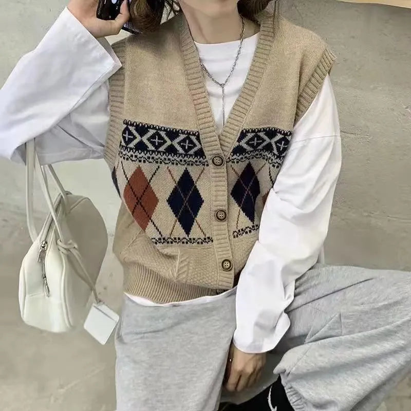 Khaki diamond plaid sleeveless loose cardigan top on a hanger.