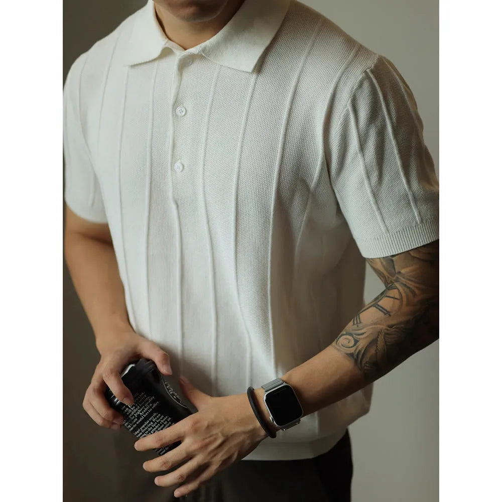 Man wearing a solid black loose fit basic polyester T-shirt for casual wear.