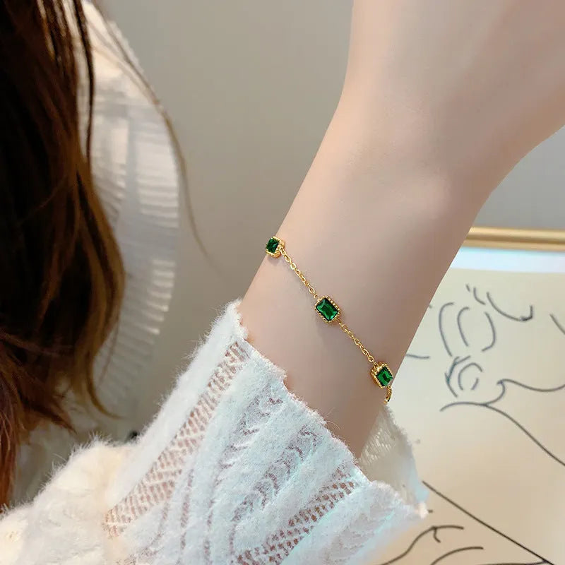 Titanium steel emerald zircon bracelet and necklace set with O-ring chain and 18K gold finish