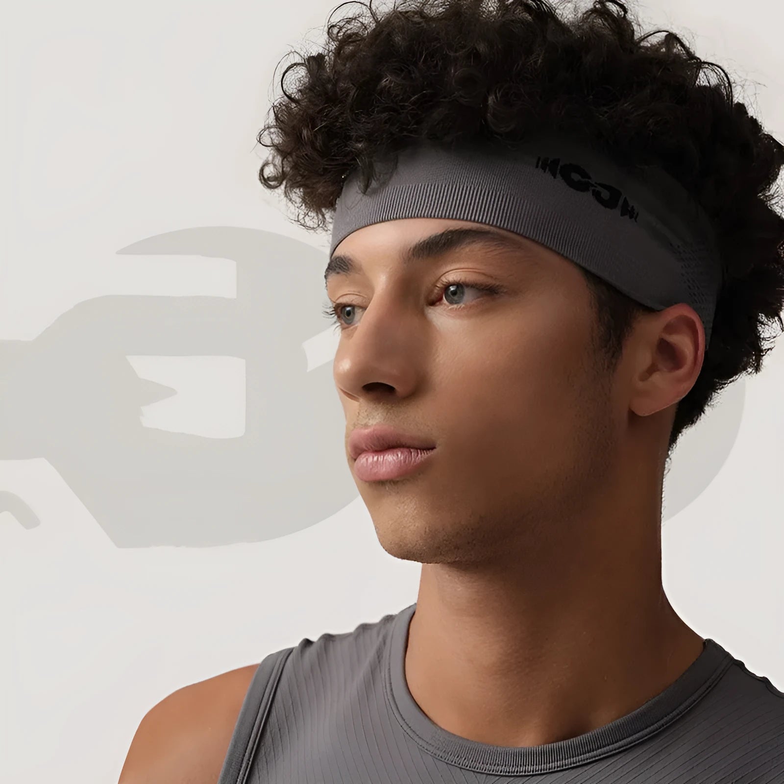 Seamless knitted exercise hair band in classic black, carbon grey, and purplish blue.