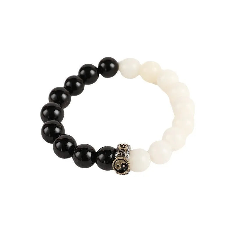 Black and white obsidian bracelet with taiji symbol and mantra bead