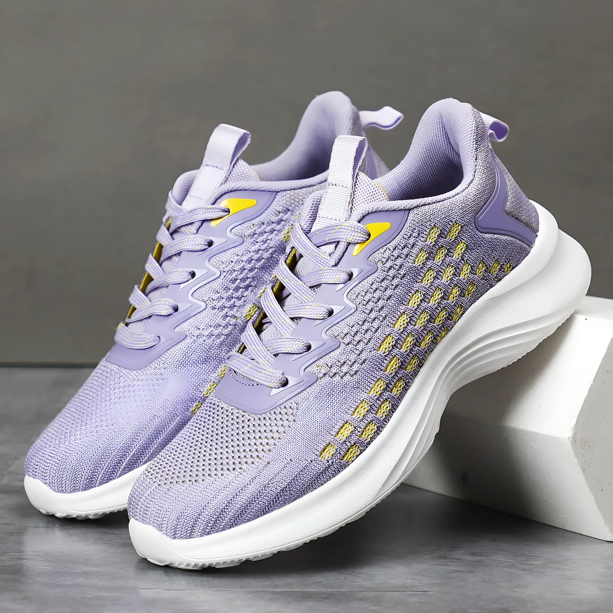 Women's lavender purple Flyknit running shoes with mesh lining and striped pattern, flat heel