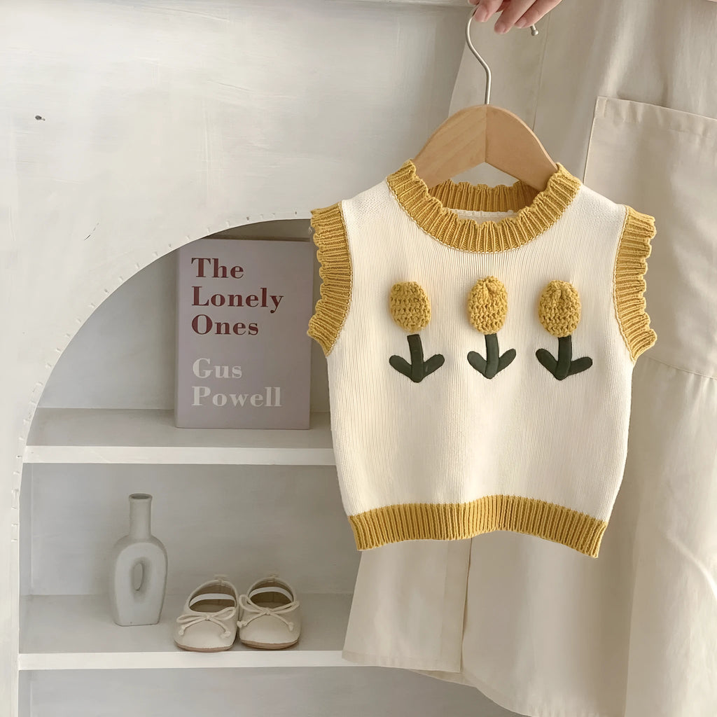 Baby girl sleeveless knitted pullover top in almond white with three-dimensional flower detail, spring autumn cotton knit