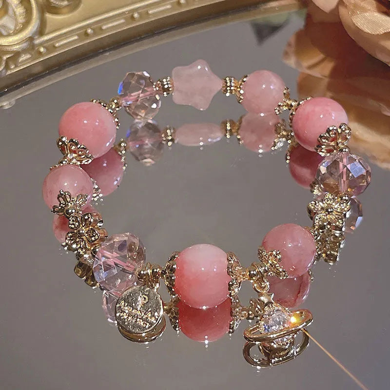 Women's Galaxy colour bracelet with snowflake pendant, bow charm, and cartoon character design