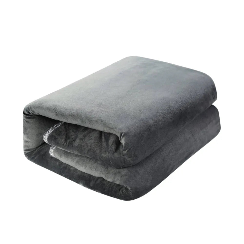 Tweed electric heating blanket in solid grey colour on a bed