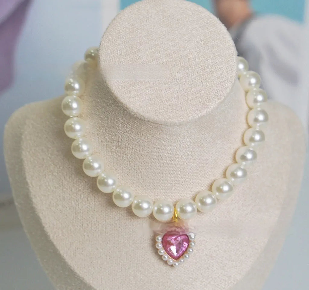 A decorative gem-style cat collar in plastic alloy resin, shown in multiple solid colours with adjustable sizing.