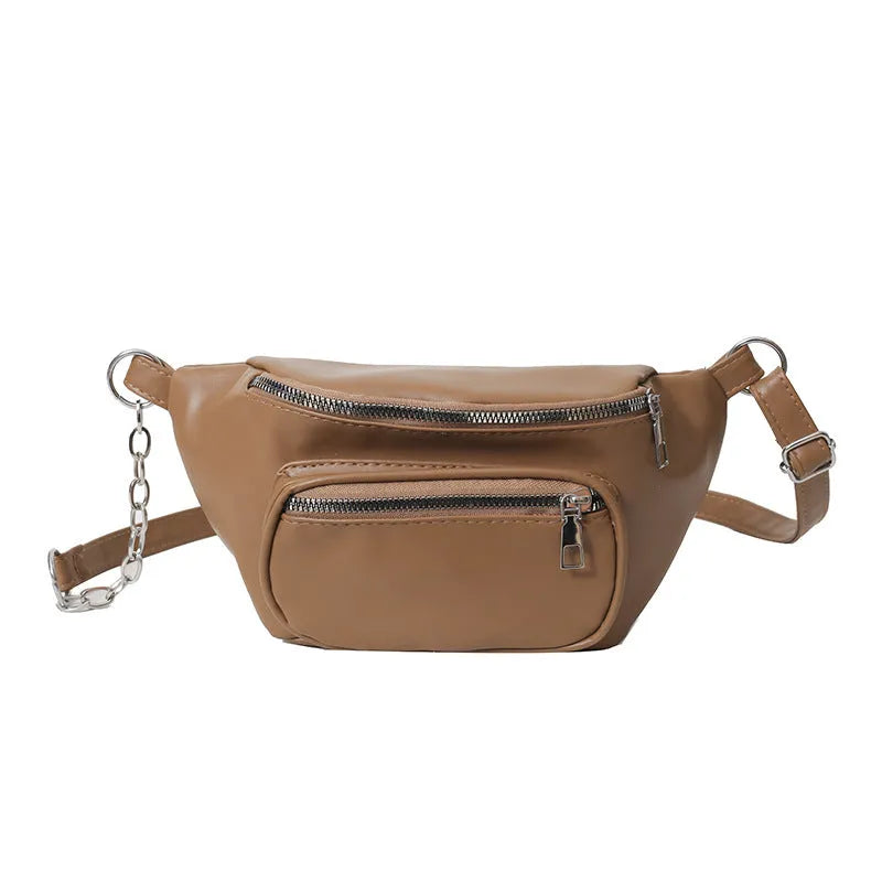 Women's soft PU leather shoulder bag with chain detail in black against a plain background