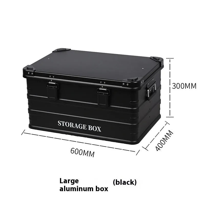 Army green waterproof storage box mounted in a vehicle cargo area.