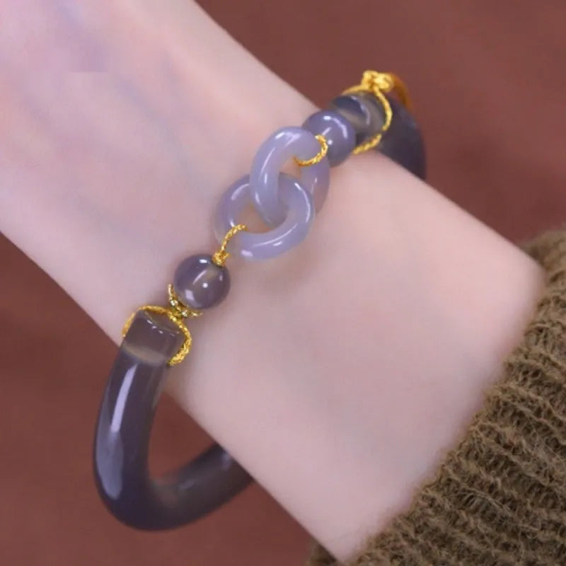 Grey retro style women's bracelet made from smoke purple agate with a ring buckle fastening.