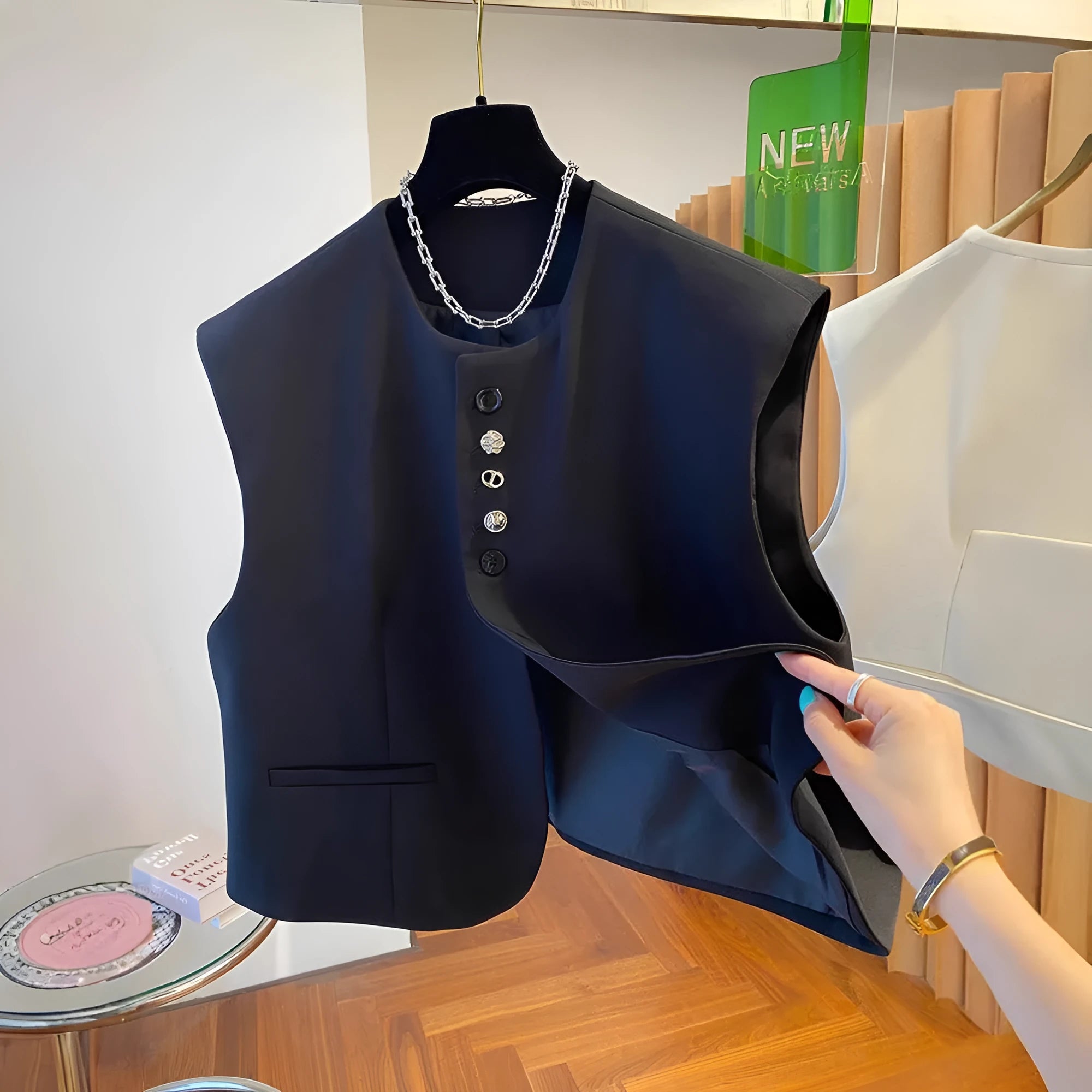 Beige loose-fitting polyester waistcoat dress with a pocket, shown on a hanger