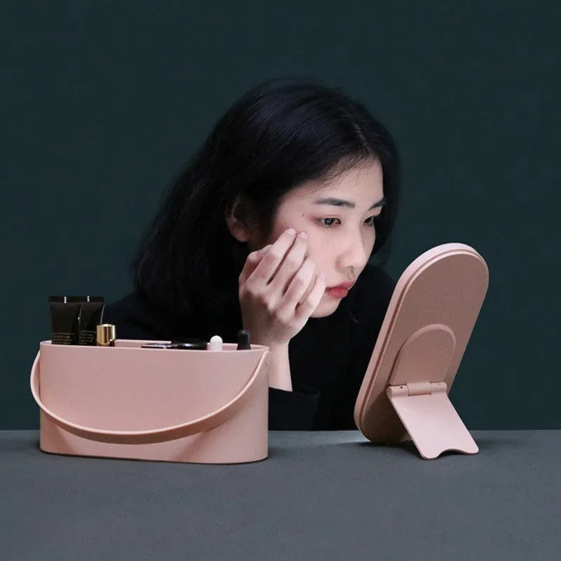 Portable pink makeup mirror storage box with adjustable angle and organiser compartments
