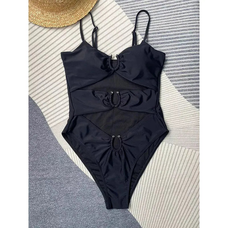 Black women's one-piece swimsuit with solid colour design and bikini style