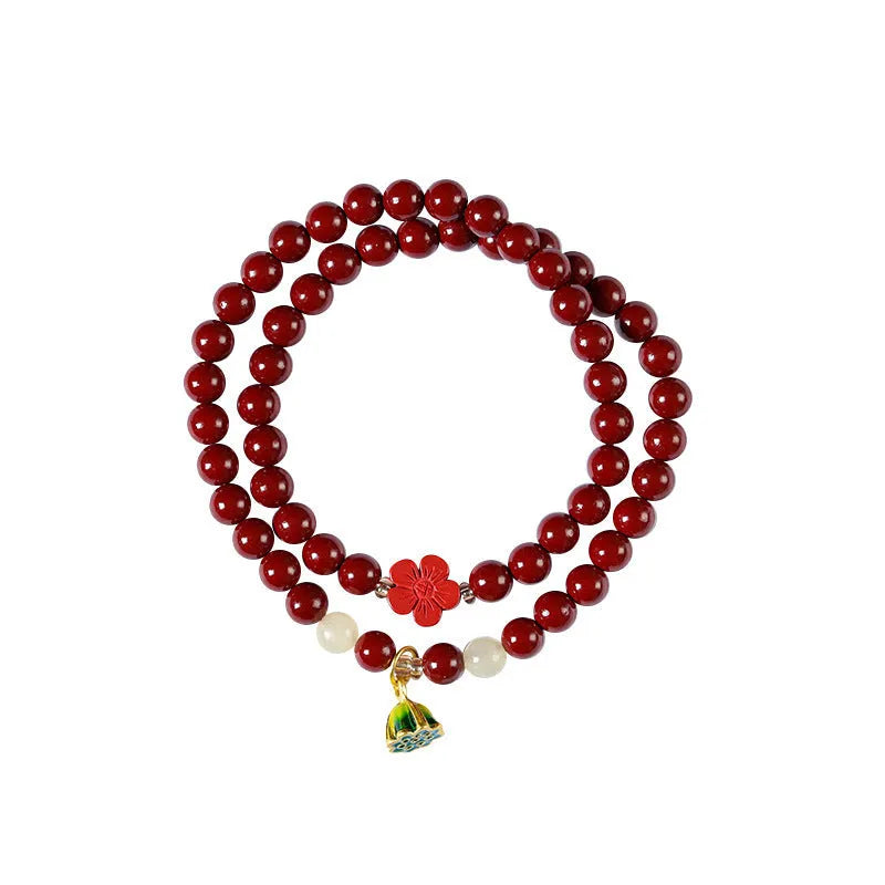 Purple gold sand bracelet with lotus seedpod centre and double circle bead design on adjustable string.