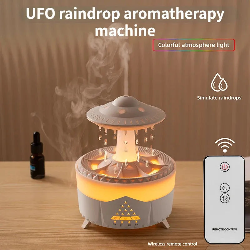 White cloud-shaped UFO raindrop humidifier diffuser with coloured night light on a wooden table.