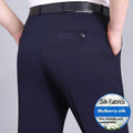 Man wearing dark blue straight-cut high-waist business trousers made from a mulberry silk blend.