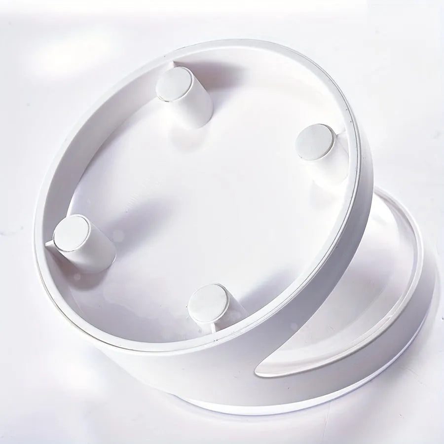 White elevated plastic cat food bowl with a tilted feeding surface for neck protection.