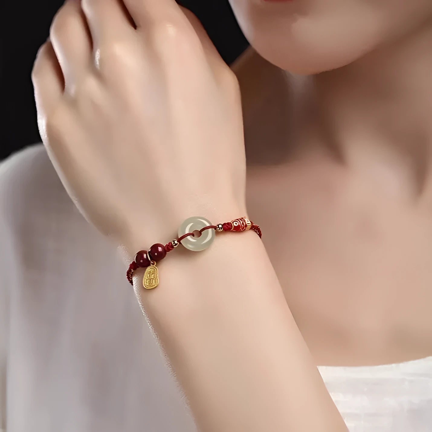 Handmade bracelet with jade peace buckle on black, colourful, or red braided rope.
