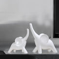Modern simple style resin elephant ornament in rose gold or white, available in large and small sizes.