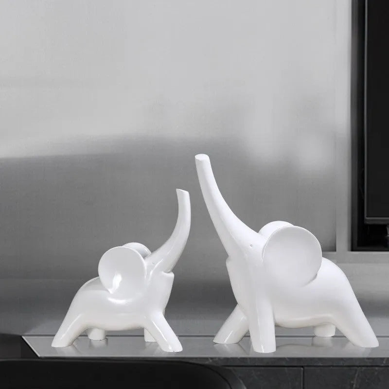 Modern simple style resin elephant ornament in rose gold or white, available in large and small sizes.