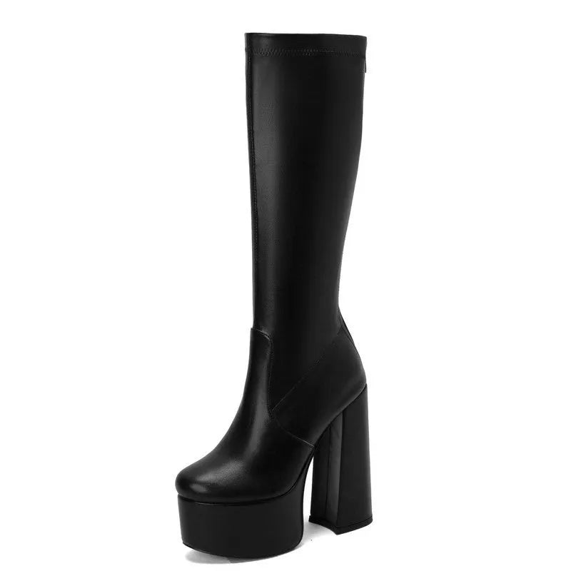 Waterproof platform stretch boots in black with a super high heel and rubber sole