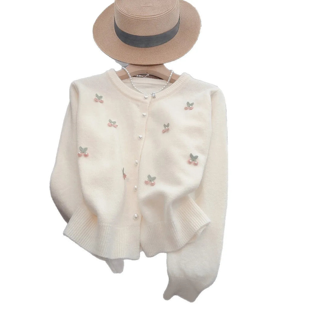 Women's pink cashmere blend cardigan coat with beaded detailing on the round neck, shown open as a slim-fit layer.