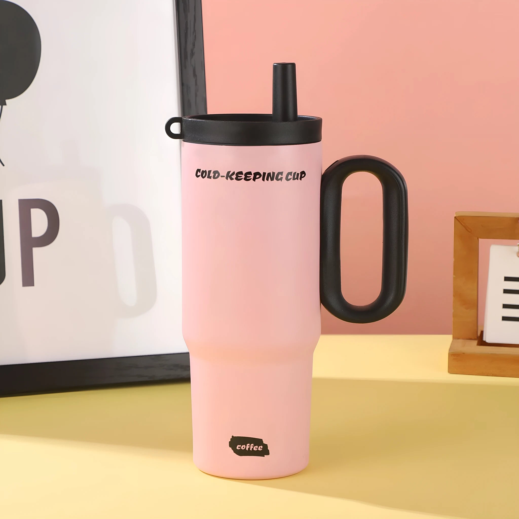 Large insulated portable straw cup with carry handle and straw in multiple colour options.