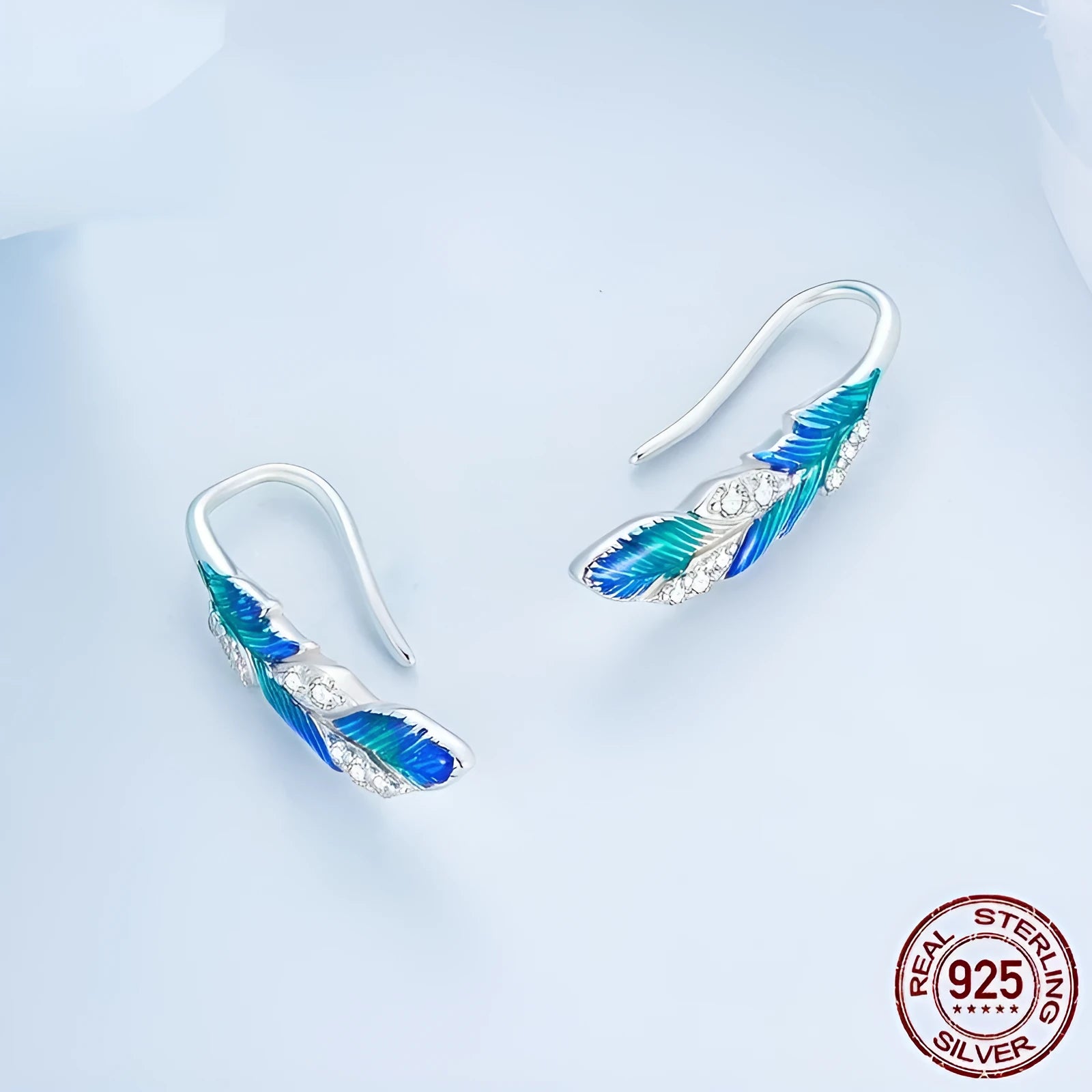 Pair of bright blue gradient feather wing stud earrings white gold plated over 925 silver