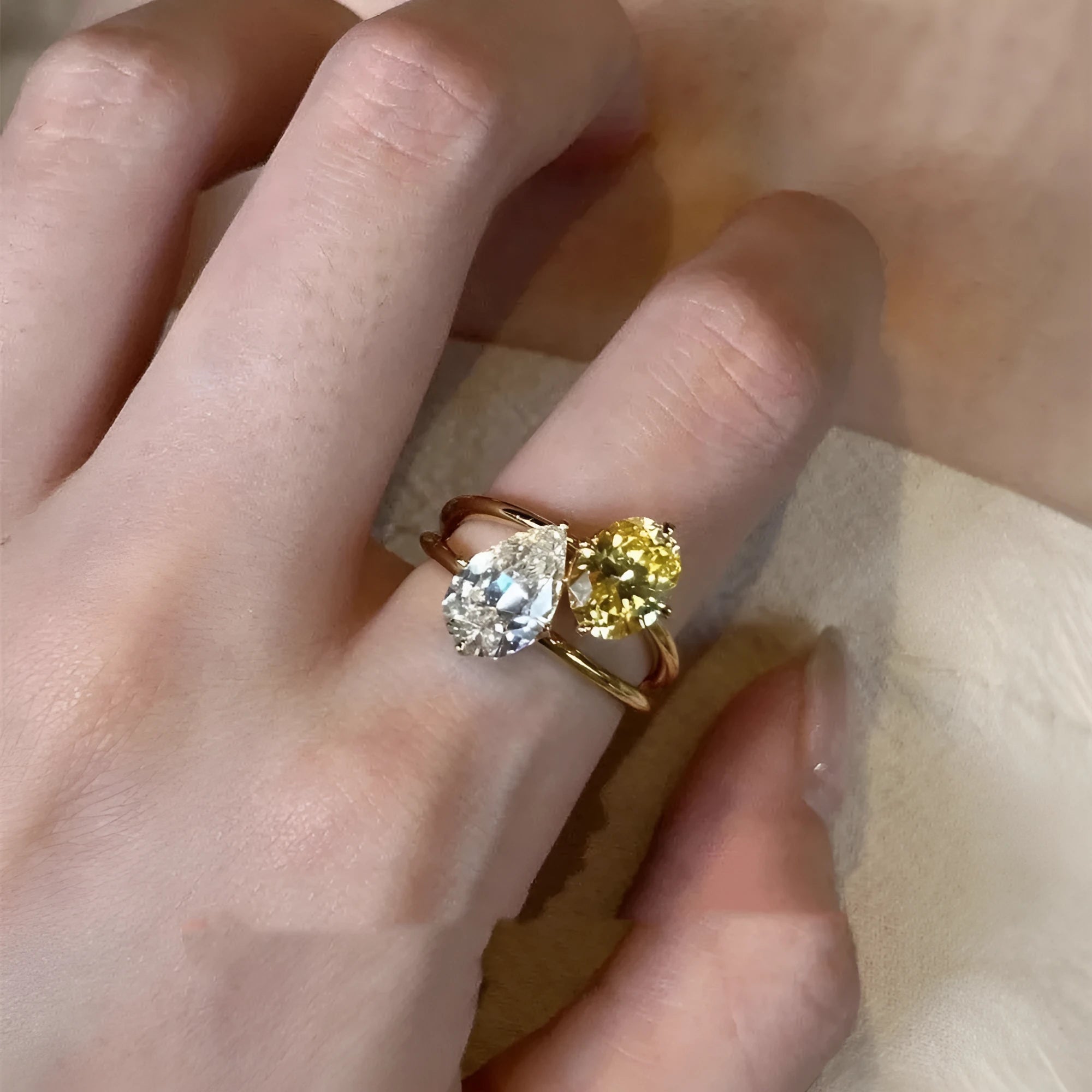 Geometric open ring with water drop double Sheng stone zircon centrepiece on copper setting